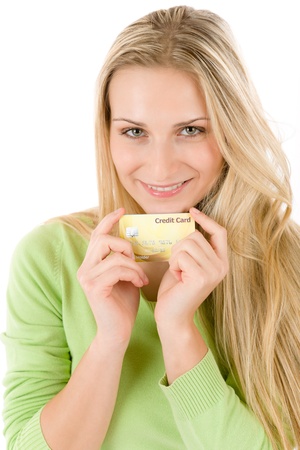 Home shopping - young woman holding credit card on white backgroundの写真素材