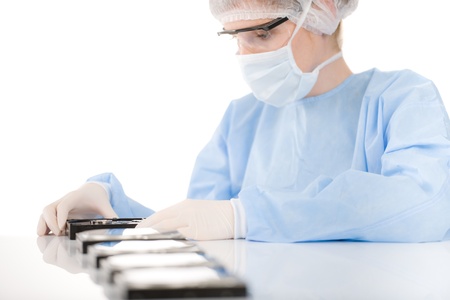 Female computer engineer repair hard disc defect, experiment in sterile laboratoryの写真素材