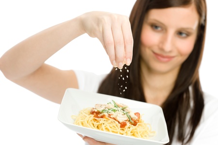Italian food - healthy woman hold spaghetti with grated cheese sauceの写真素材