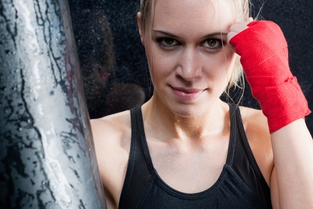Boxing training blond woman sparring and sweatingの写真素材