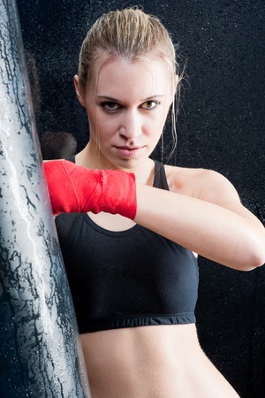 Boxing training blond woman sparring and sweatingの写真素材