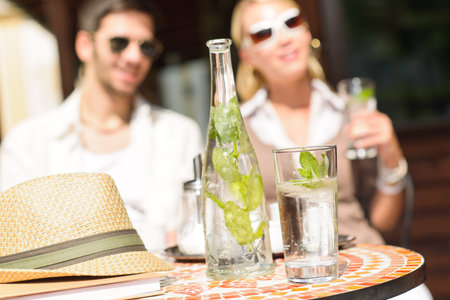 Close-up of terrace italian style refreshment table elegant romantic coupleの写真素材