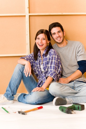 Home improvement young cheerful couple repair tool relax on floorの写真素材