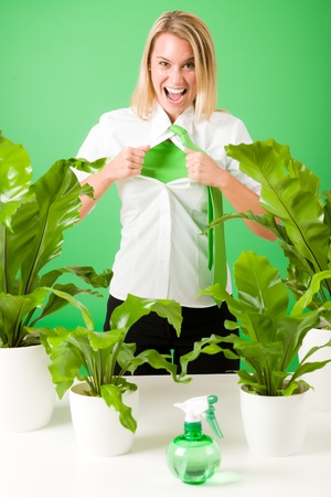 Green business superhero woman crazy shouting plants environment friendlyの写真素材