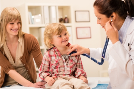 Little girl being examine with stethoscope by pediatricianの写真素材