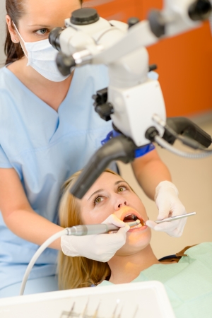 Young woman having dental surgery in stomatology clinic teeth checkupの写真素材
