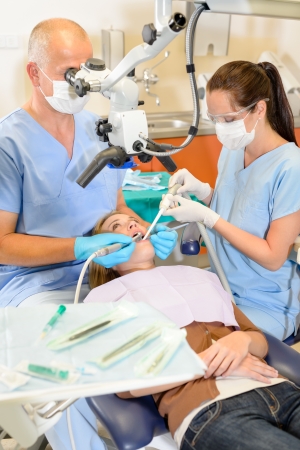 Woman at dentist surgery having dental checkup at stomatology clinicの写真素材
