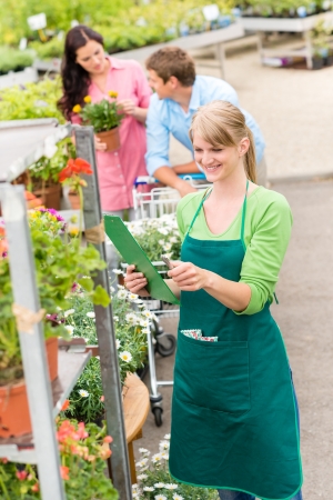 Female florist working at garden centre retail inventoryの写真素材