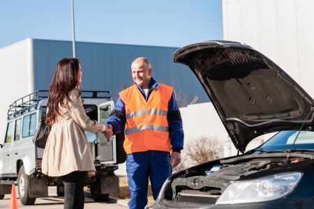 Woman shaking hands with mechanic car breakdown crash accident manの写真素材