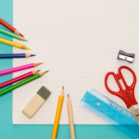 Back to school children accessories on striped notepadの写真素材