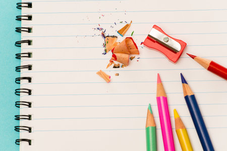 Color pencils and sharpener shaving back to school