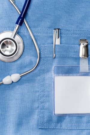 Doctor ID name tag on lab coat with stethoscopeの写真素材