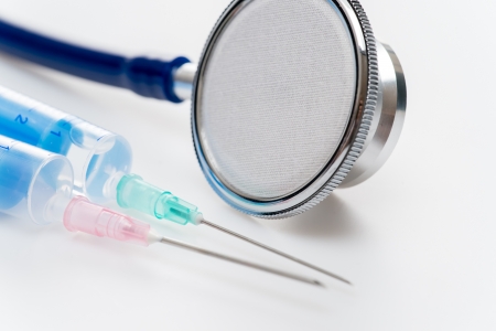 Stethoscope with injections close-up medical equipment white backgroundの写真素材