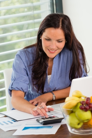 Happy woman student studying exam university libraryの写真素材