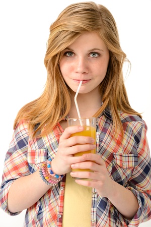 Pretty girl drinking juice with straw isolated on white backgroundの写真素材