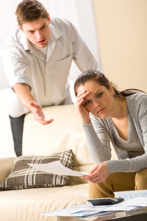 Worried arguing couple has financial crisisの写真素材