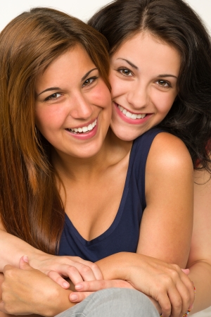 Portrait of embracing happy best friendの写真素材