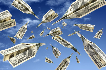 dollar banknotes flying on blue sky