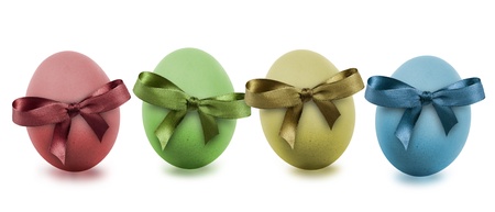 colorful easter eggs with ribbon, isolated on whiteの写真素材