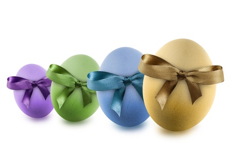 colorful easter eggs with ribbon, isolated on whiteの写真素材