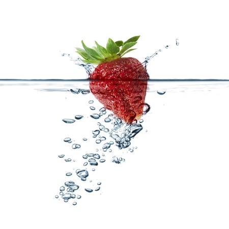 strawberry splash in transparent water, on white backgroundの写真素材