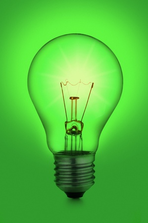 incandescent light bulb, on green backgroundの写真素材