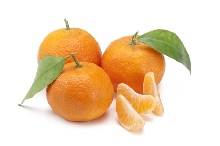 tangerines with cloves, on white backgroundの写真素材