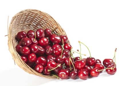 basket with cherries, on white backgroundの写真素材