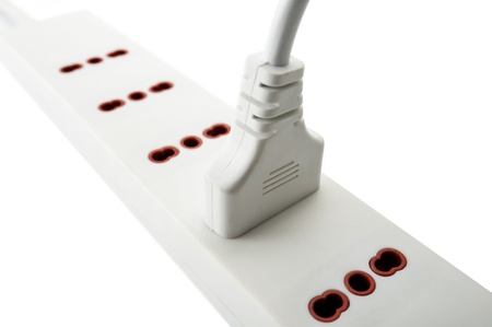 power strip with single plug inserted, isolated on whiteの写真素材
