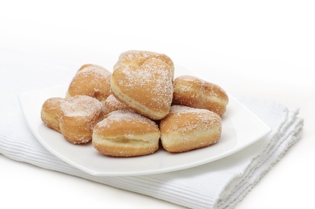 donuts heart-shaped on plate, on white backgroundの写真素材