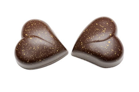 a pair of chocolates heart-shaped, isolated on whiteの写真素材