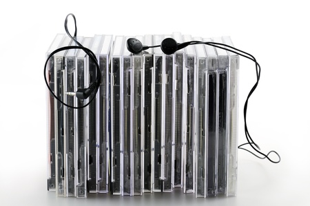 stack of compact disk with earphones, on white backgroundの写真素材