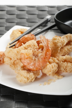 plate with fried mixed seafood with chopsticksの写真素材