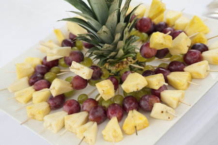 buffet table with fruit skewers