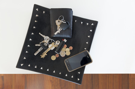 black wooden tray with mans personal itemsの写真素材