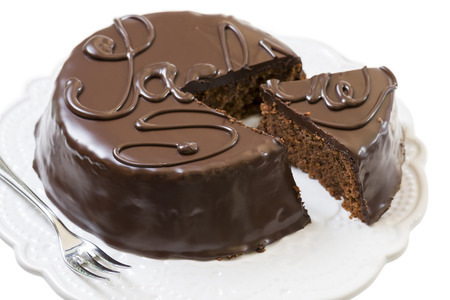 traditional sacher cake sliced on white plateの写真素材