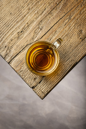 top view glass cup of tea on wooden tableの写真素材