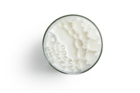 top view glass full of milk on white backgroundの写真素材