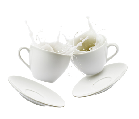 Cups full of milk bump and splashing, isolated on white backgroundの写真素材
