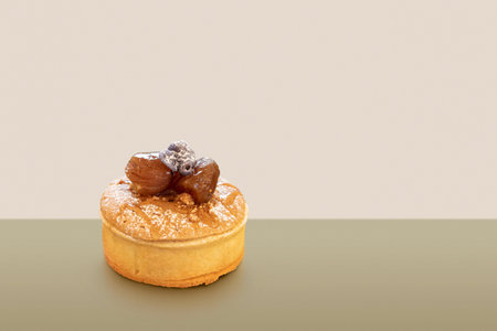 mini cake decorated with marron glaces on colorful background