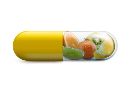 vitamin c pill with citrus fruits inside on with backgroundの写真素材