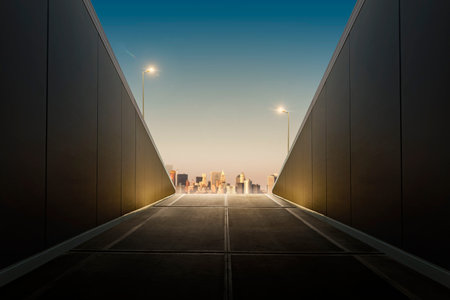 View of urban tunnel exit with city on background