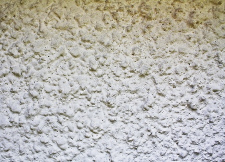 Rough white plaster wall texture backgroundの写真素材