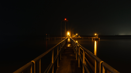 A golden light path and platform in the riverの写真素材
