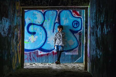 Young graffiti art in a bunkerの写真素材