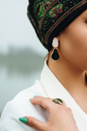 portrait of a girl with a scarf on her head in natureの写真素材