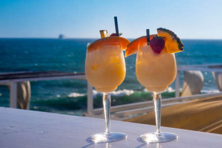 two summer cocktails on the background of the seaの写真素材