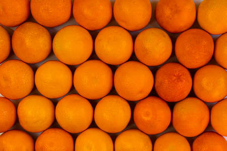 background of whole orangesの写真素材