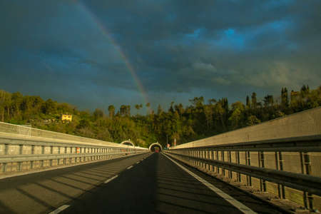 the sky with rainbow after the storm over the expresswayの写真素材