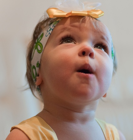 Little girl looks upの写真素材